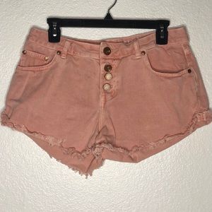 blush acid-washed jean shorts